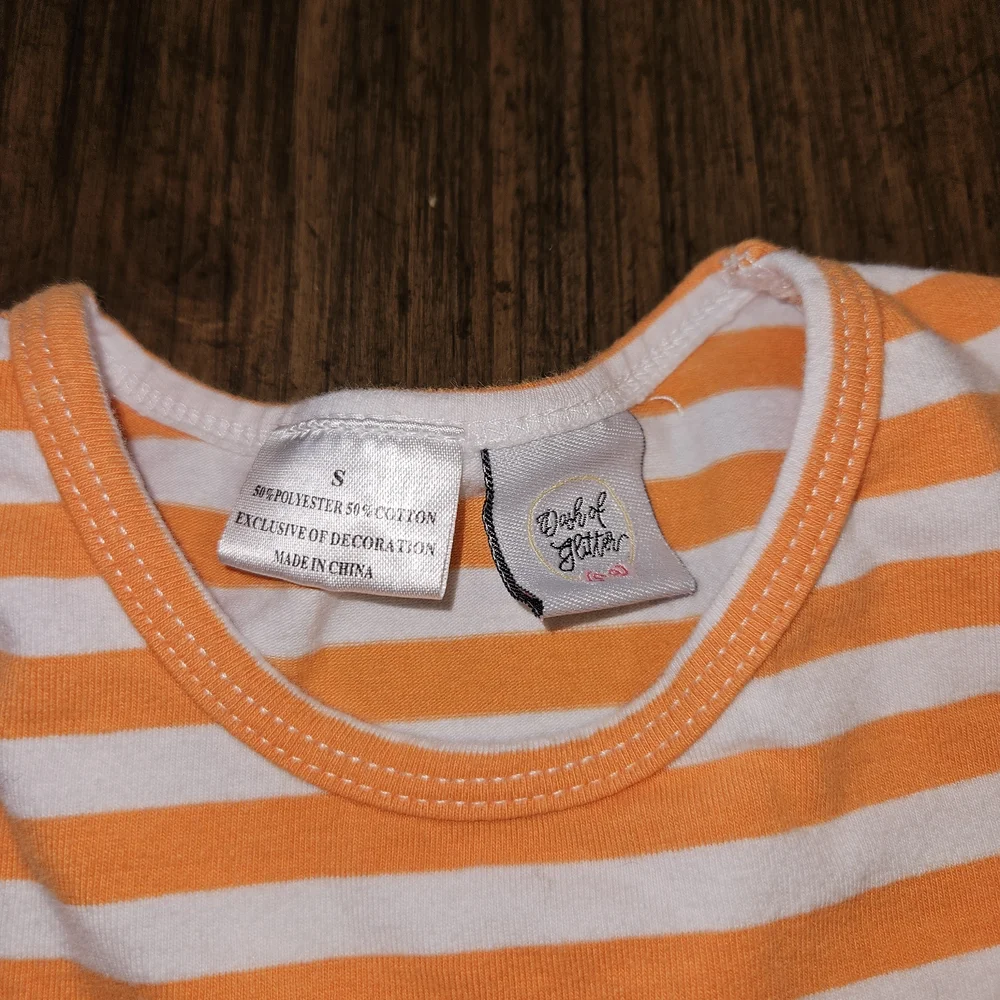 Vibrant Kids Dress with Orange Stripes and Floral Design